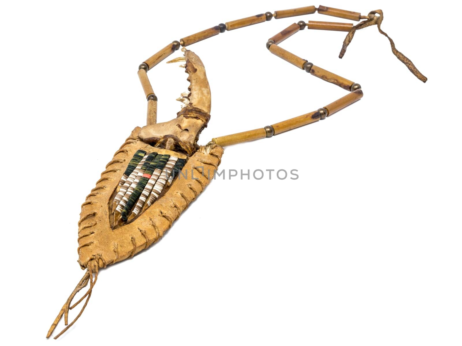 Indian bone knife with a handle made of fox bones in a quiver of rawhide decorated with porcupine bristles
