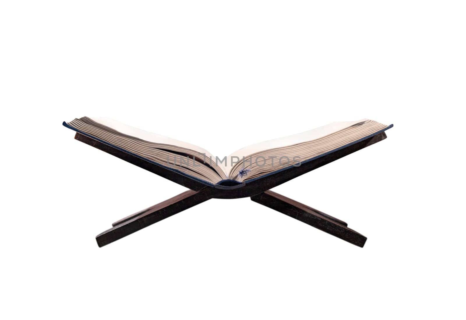 Quran open on wooden placemat isolated over white background