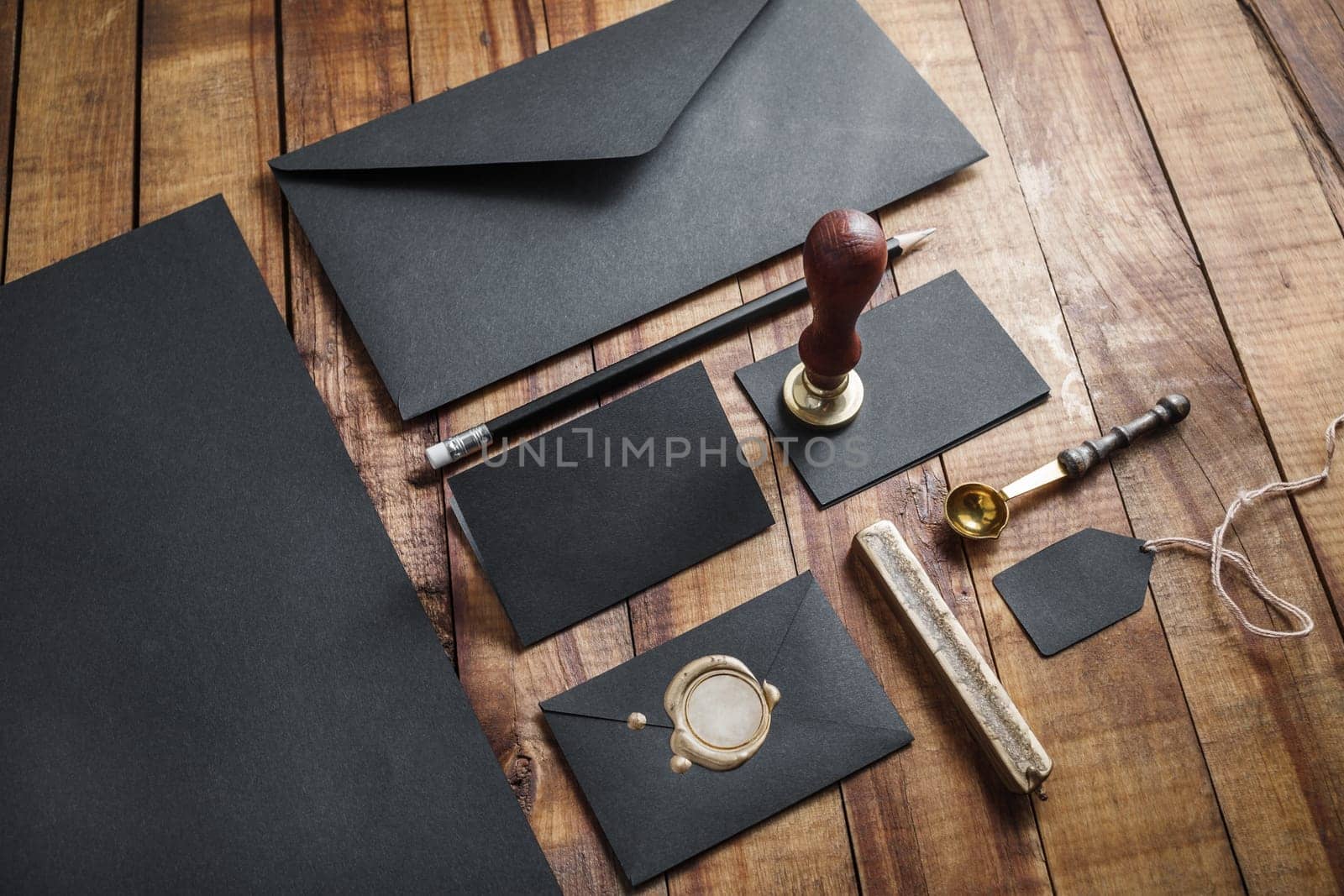 Blank retro stationery on vintage wood table background. Mockup for your design.
