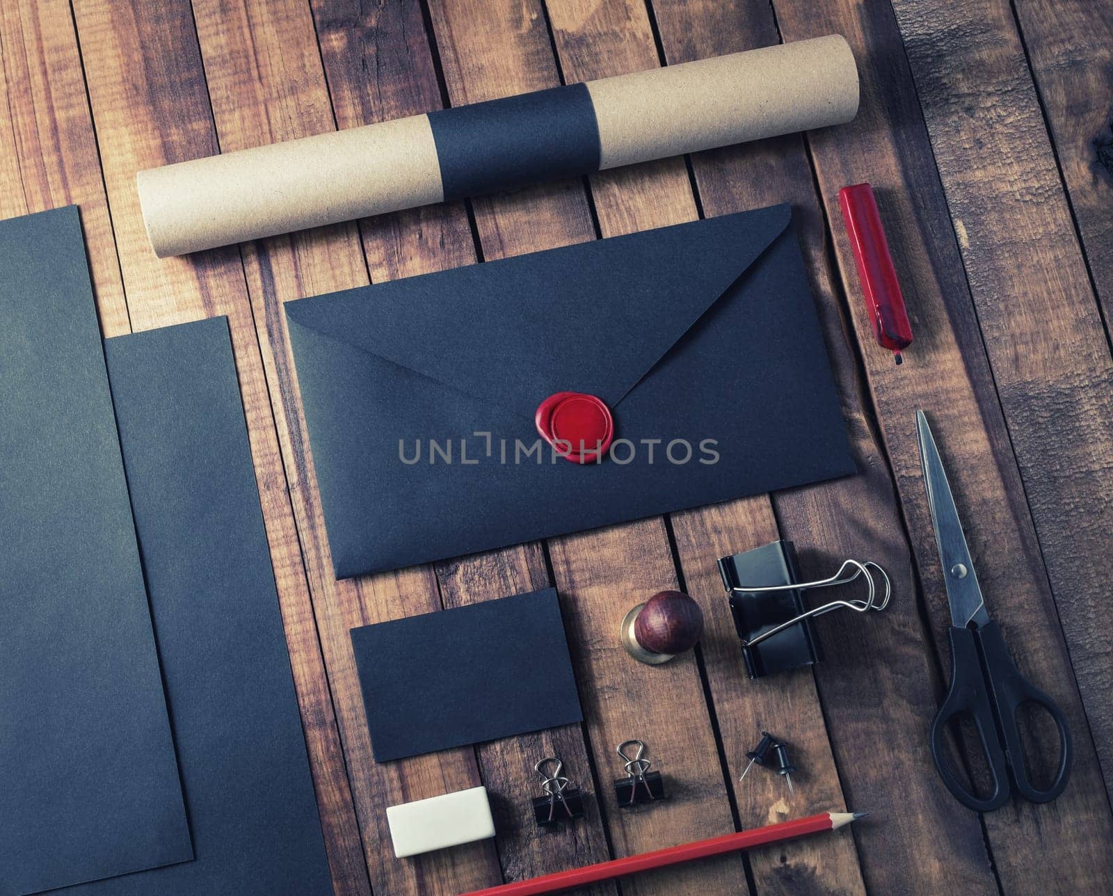 Blank black retro stationery template on wooden background.