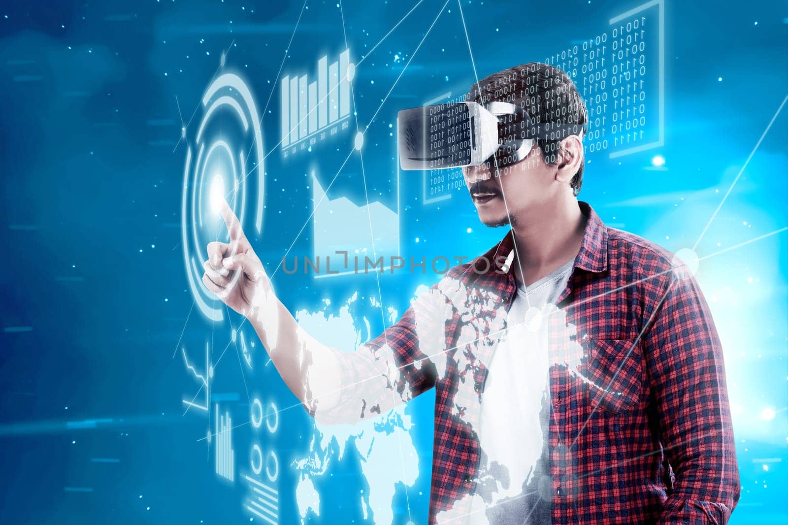 Asian man touching blue sphere on digital interface with virtual reality device display the world map, graphic bar and binary code. Augmented reality technology