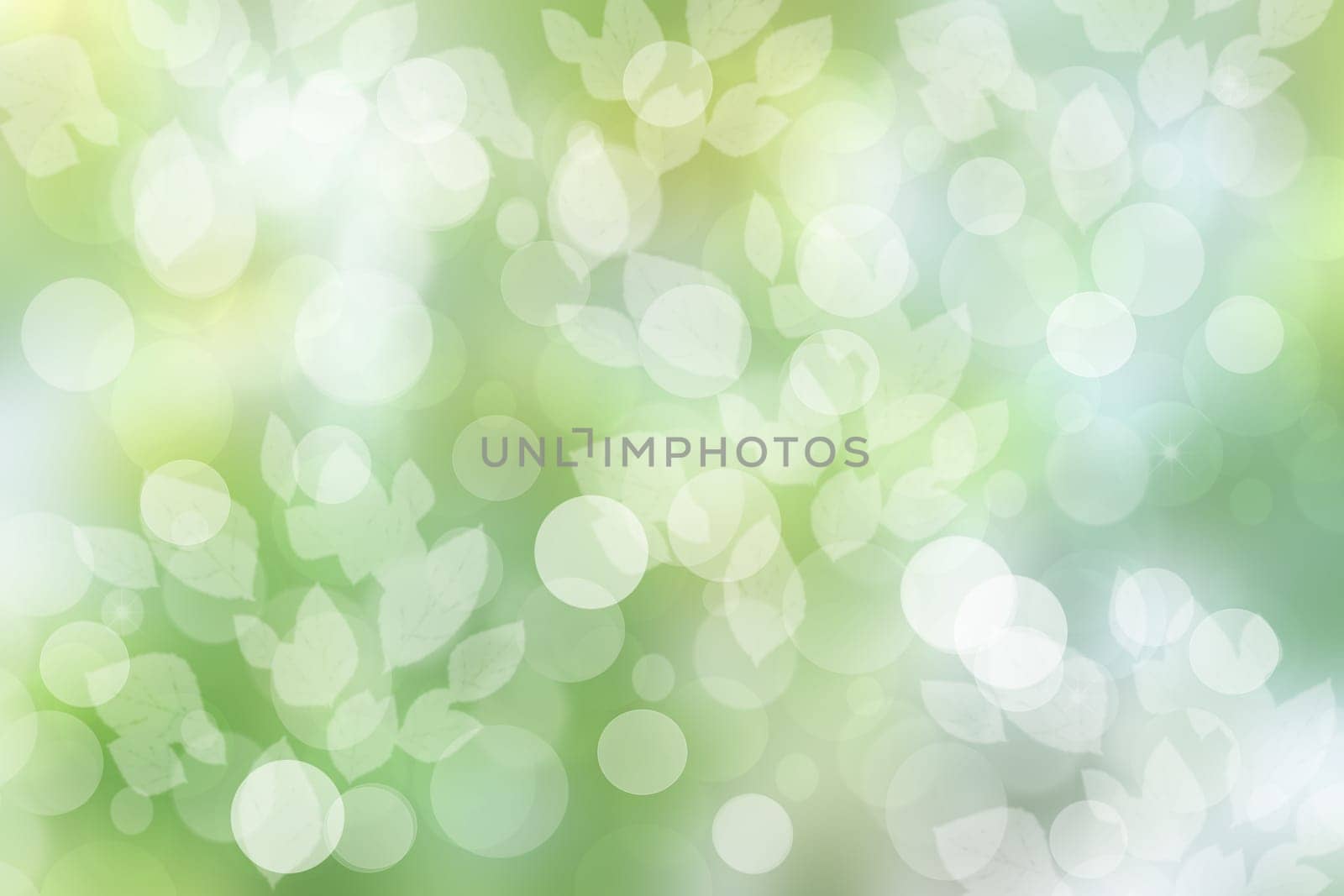 Abstract natural spring light green and yellow background texture with leaves and blurred bokeh circles. Space for design.