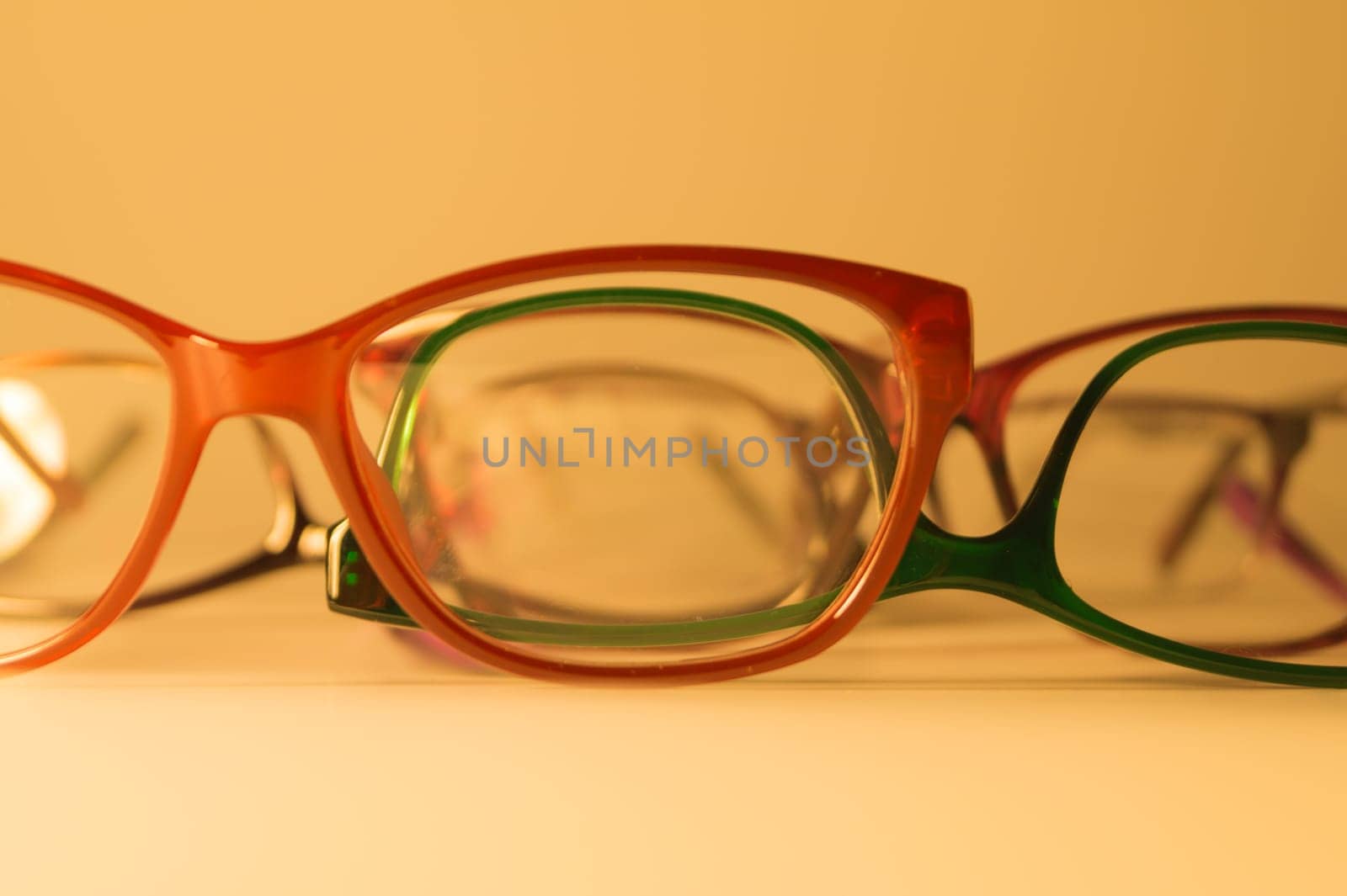 Rimmed eyeglasses closeup on a white background abstract view