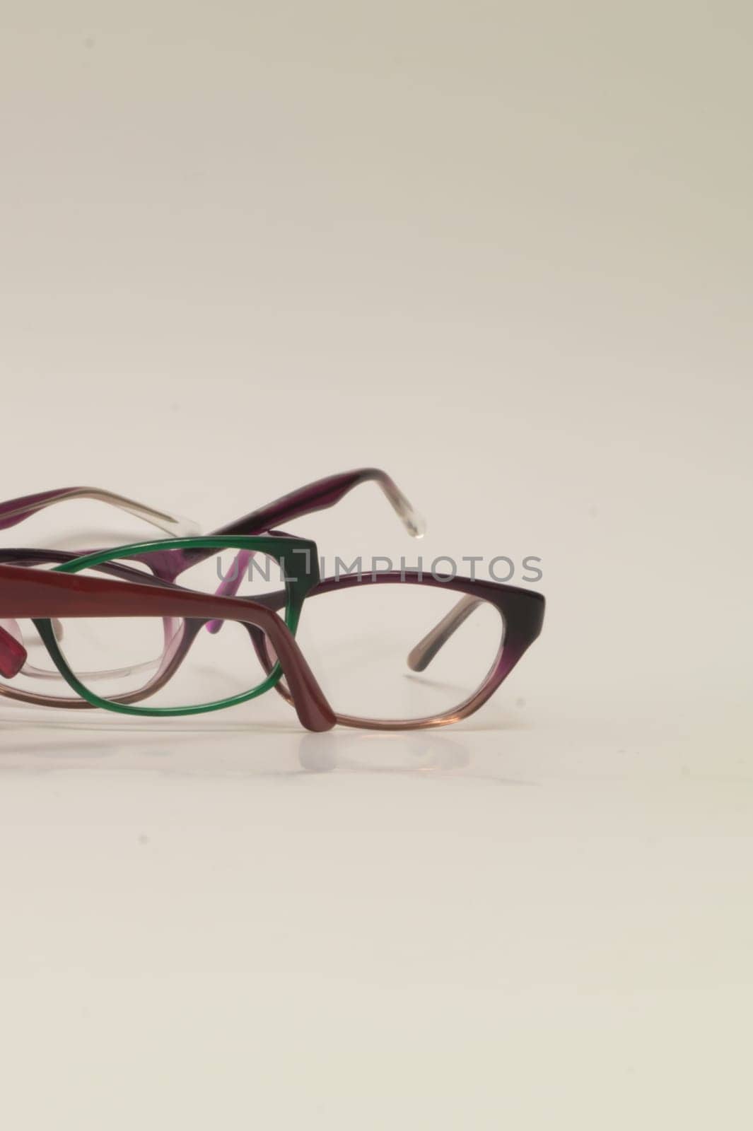 Rimmed eyeglasses closeup on a white background abstract view