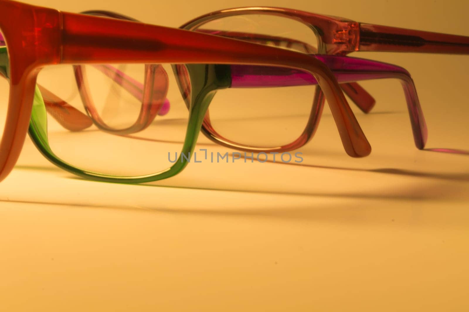 Rimmed eyeglasses closeup on a white background abstract view