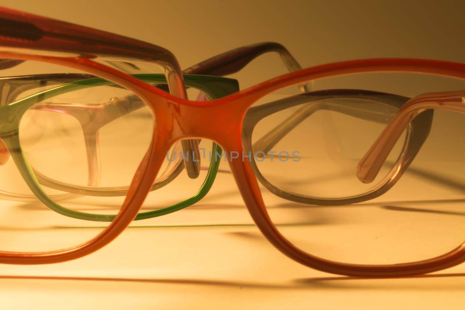 Rimmed eyeglasses closeup on a white background abstract view