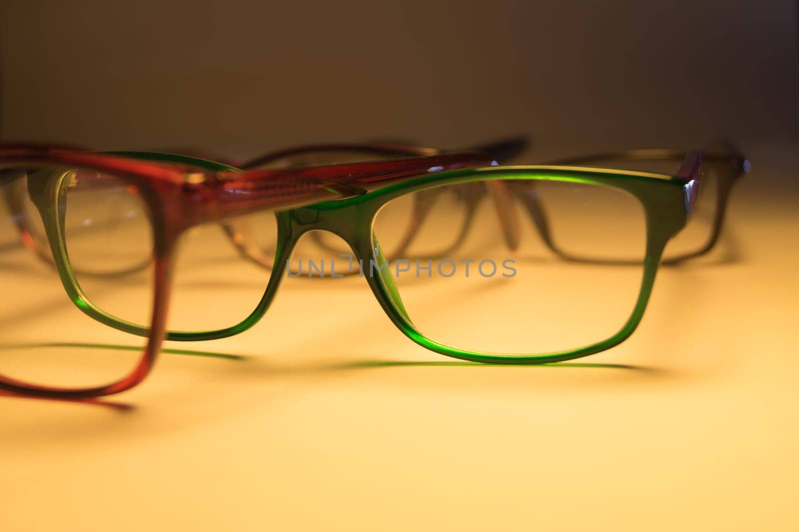 Rimmed eyeglasses closeup on a white background abstract view