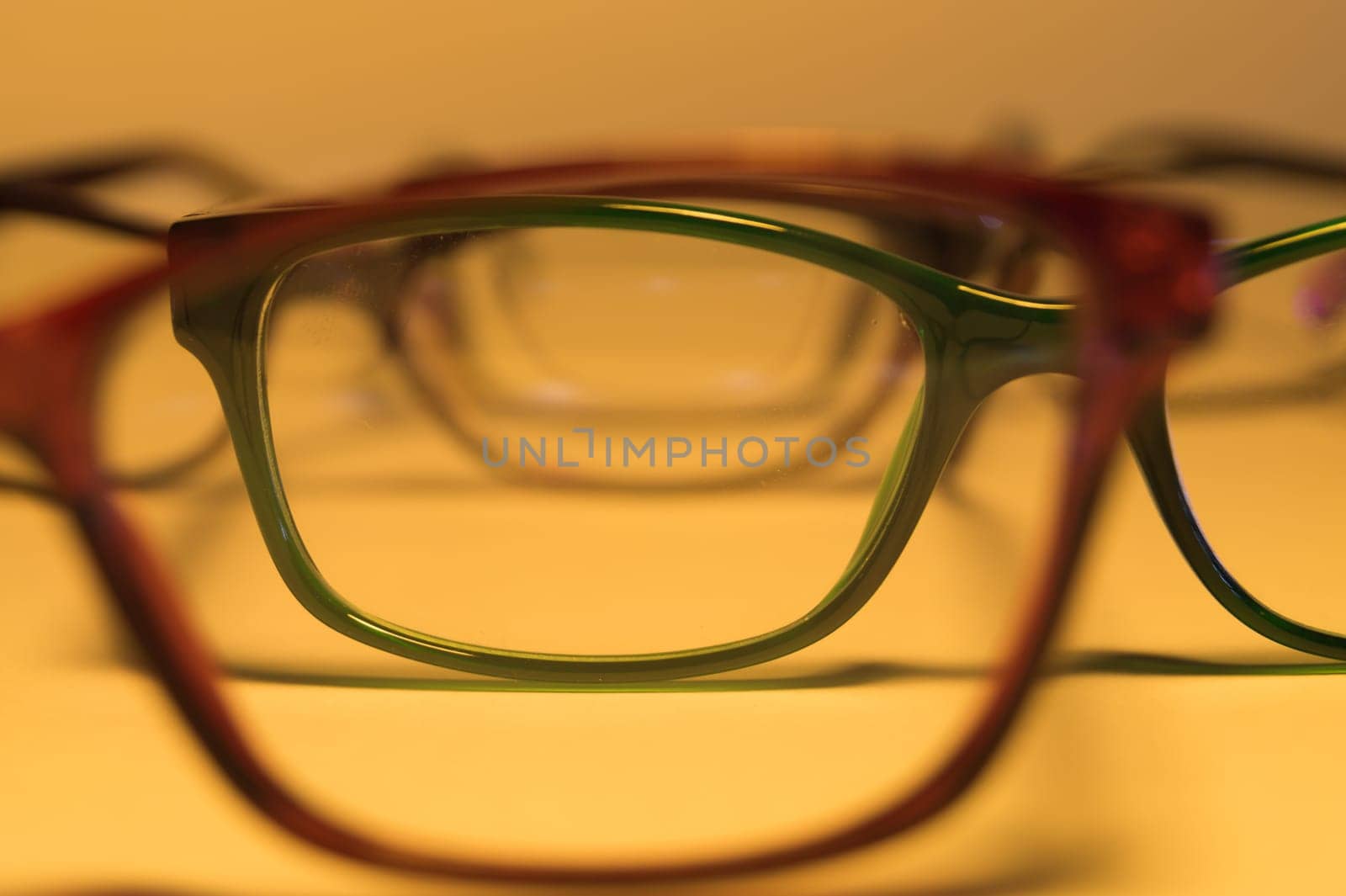 Rimmed eyeglasses closeup on a white background abstract view