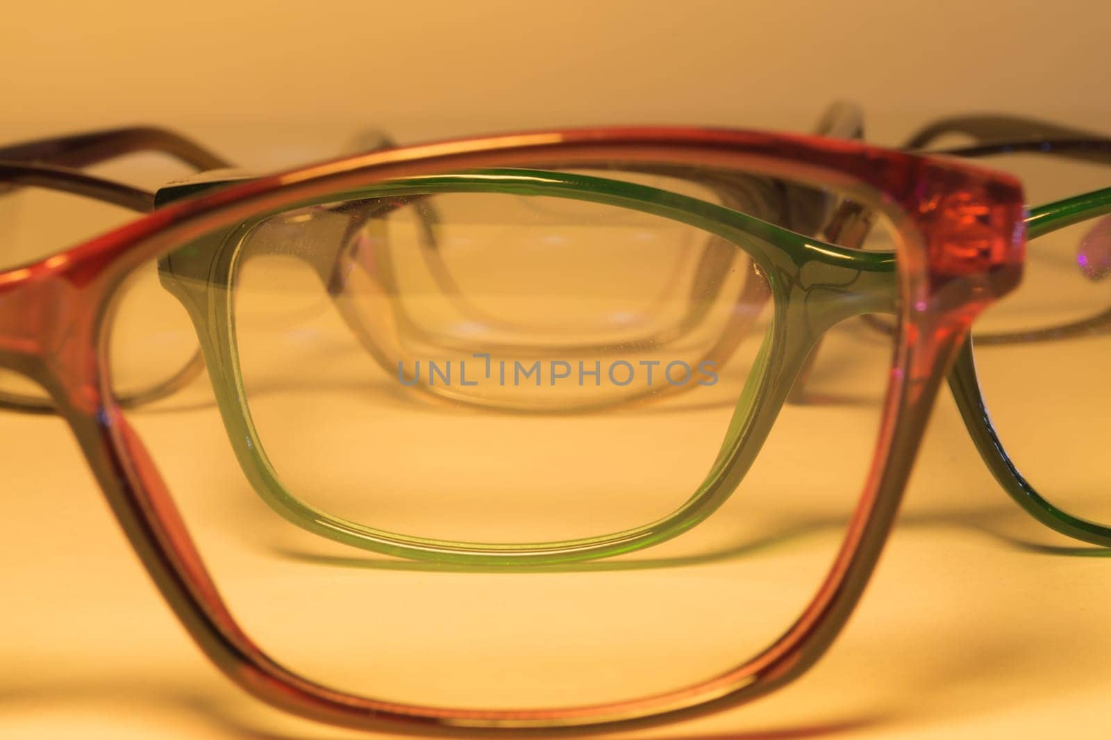 Rimmed eyeglasses closeup on a white background abstract view
