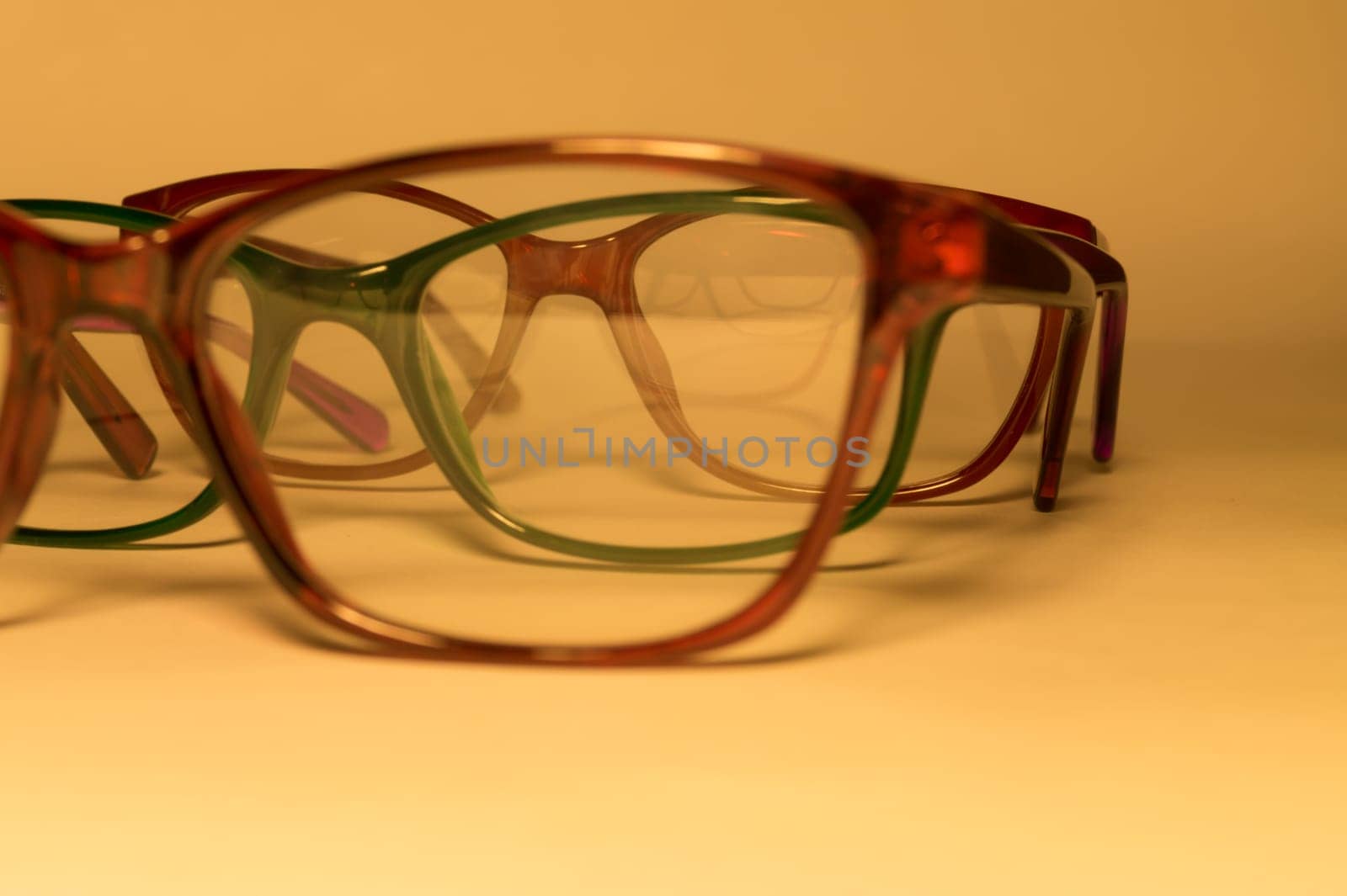 Rimmed eyeglasses closeup on a white background abstract view