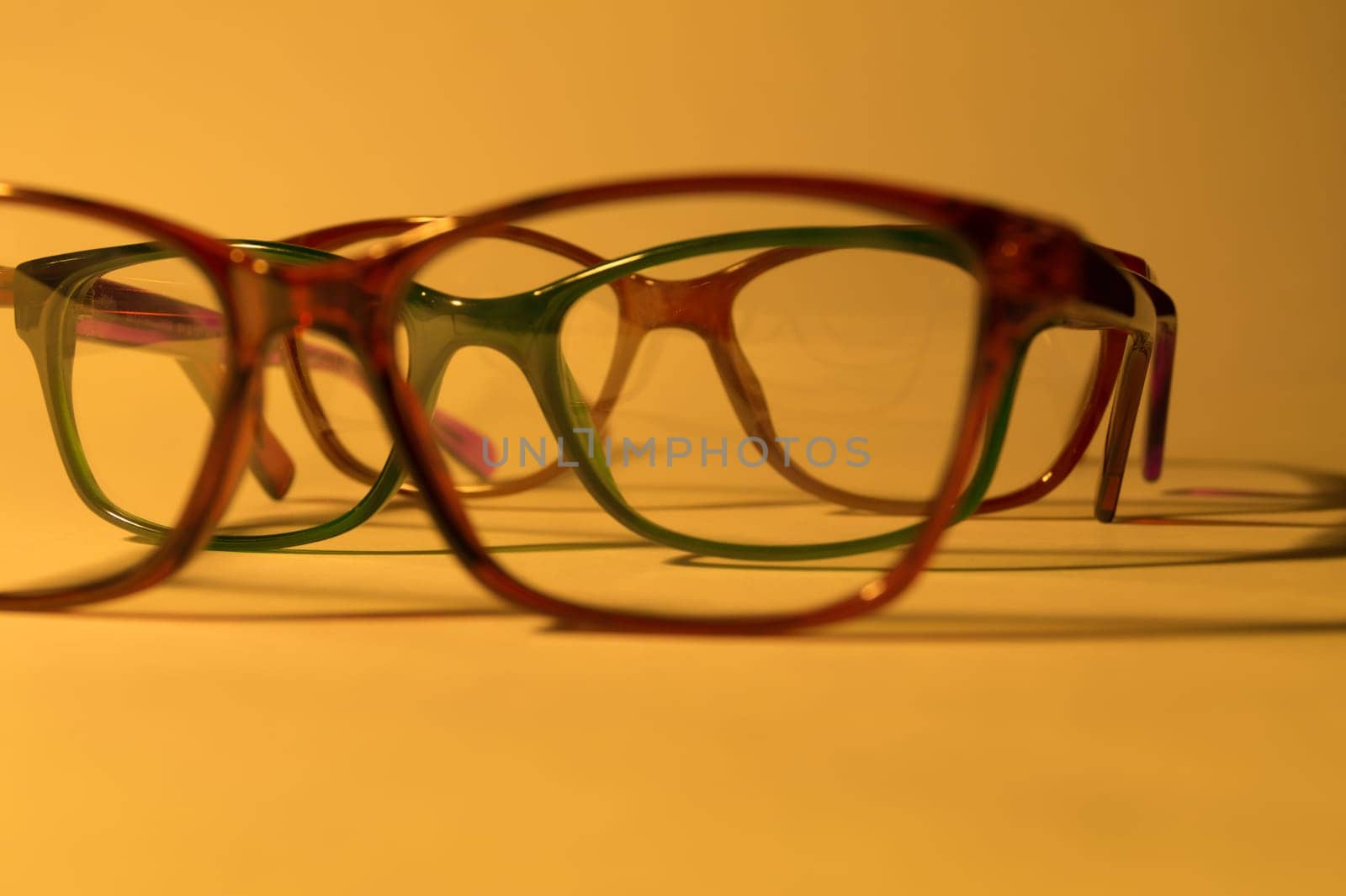 Rimmed eyeglasses closeup on a white background abstract view
