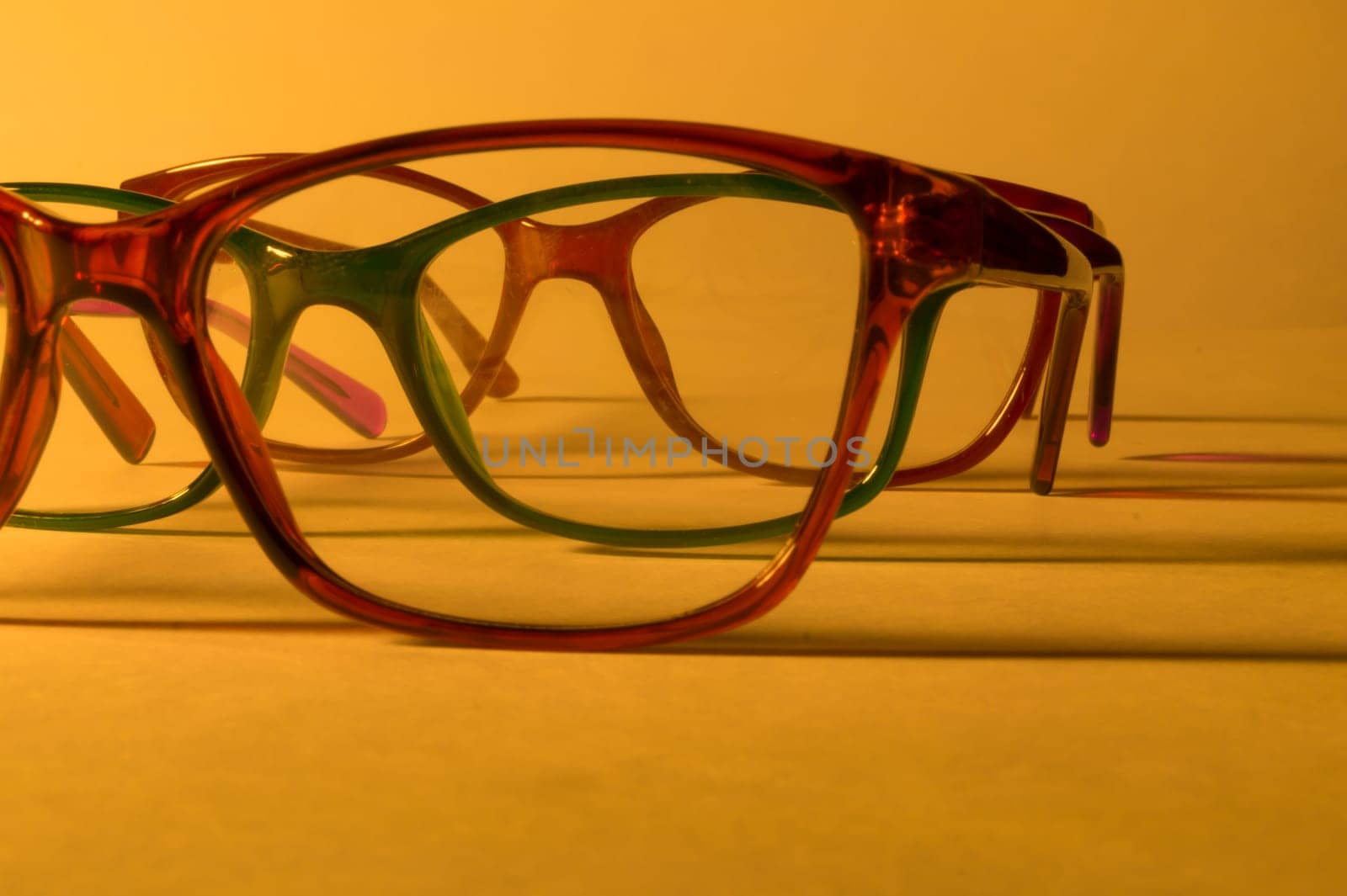 Rimmed eyeglasses closeup on a white background abstract view