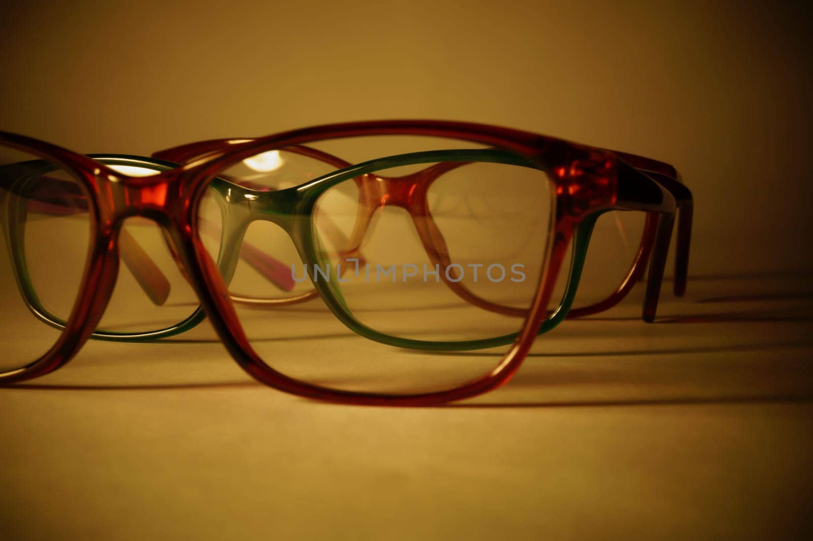 Rimmed eyeglasses closeup on a white background abstract view
