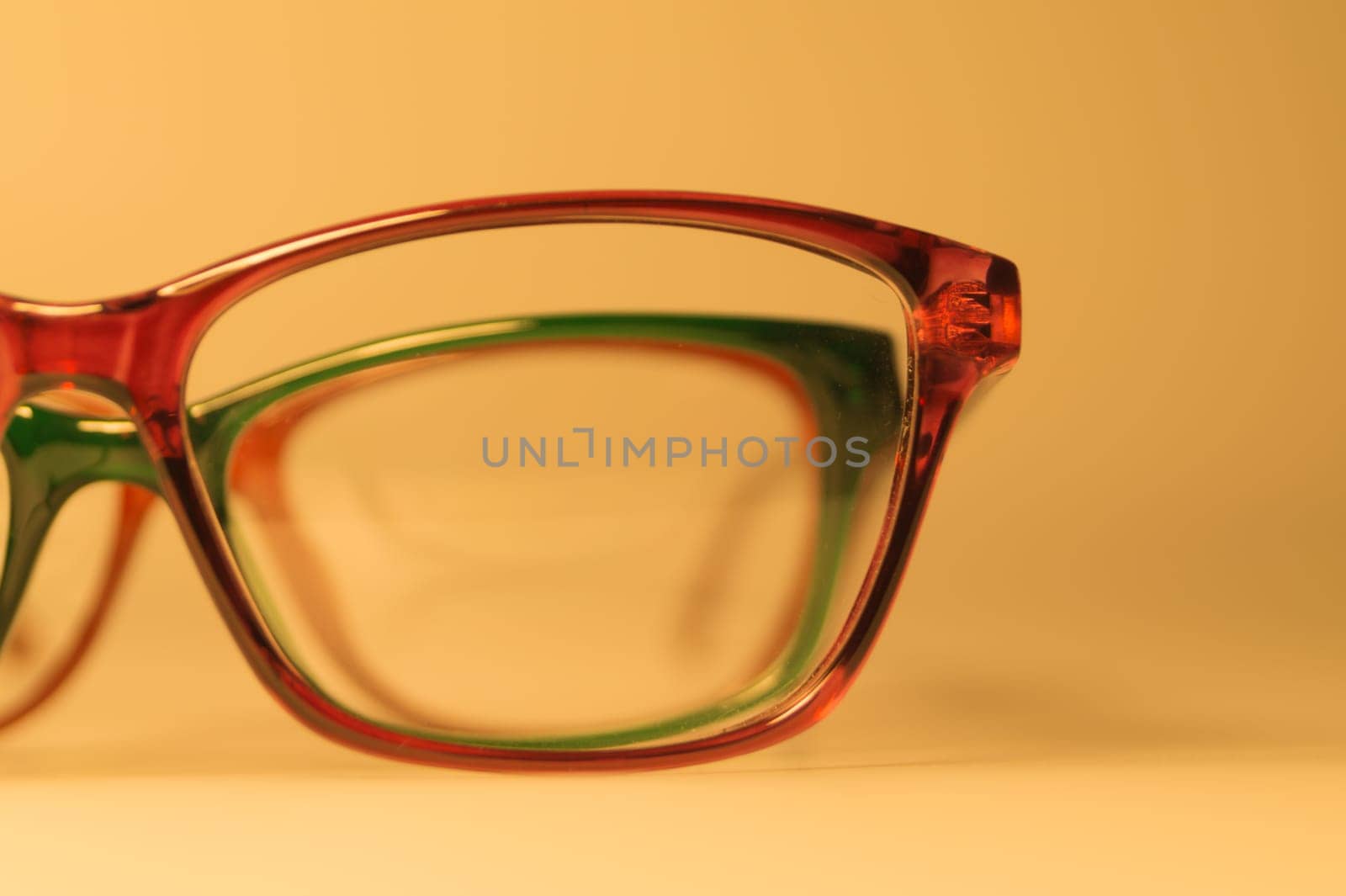 Rimmed eyeglasses closeup on a white background abstract view