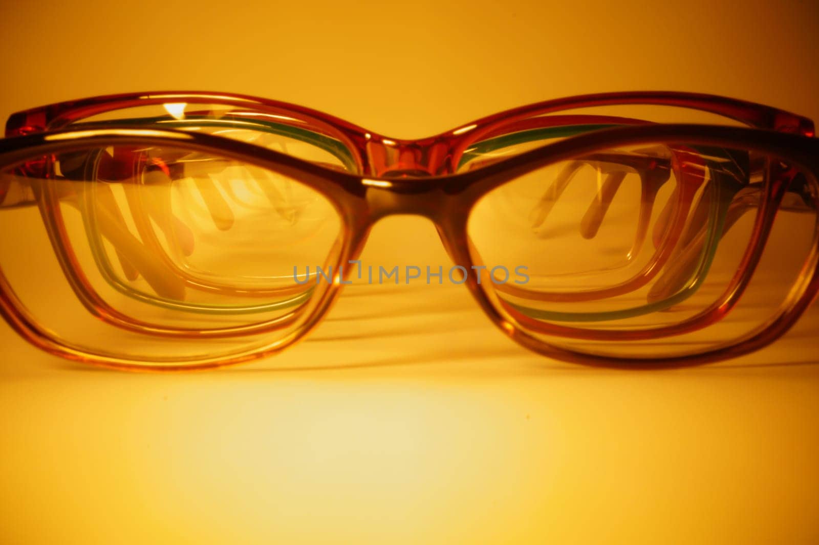 Rimmed eyeglasses closeup on a white background abstract view