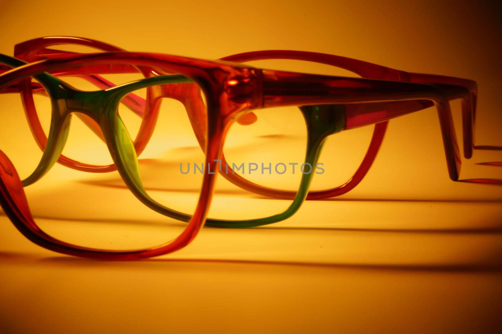 Rimmed eyeglasses closeup on a white background abstract view