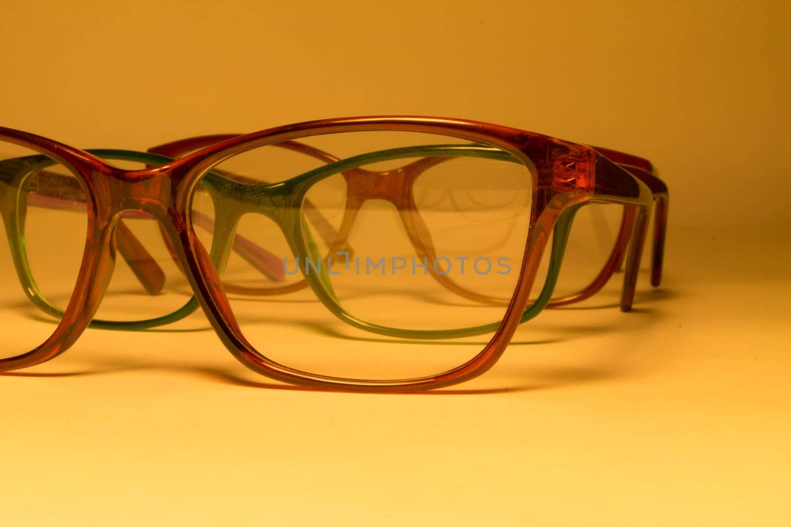 Rimmed eyeglasses closeup on a white background abstract view
