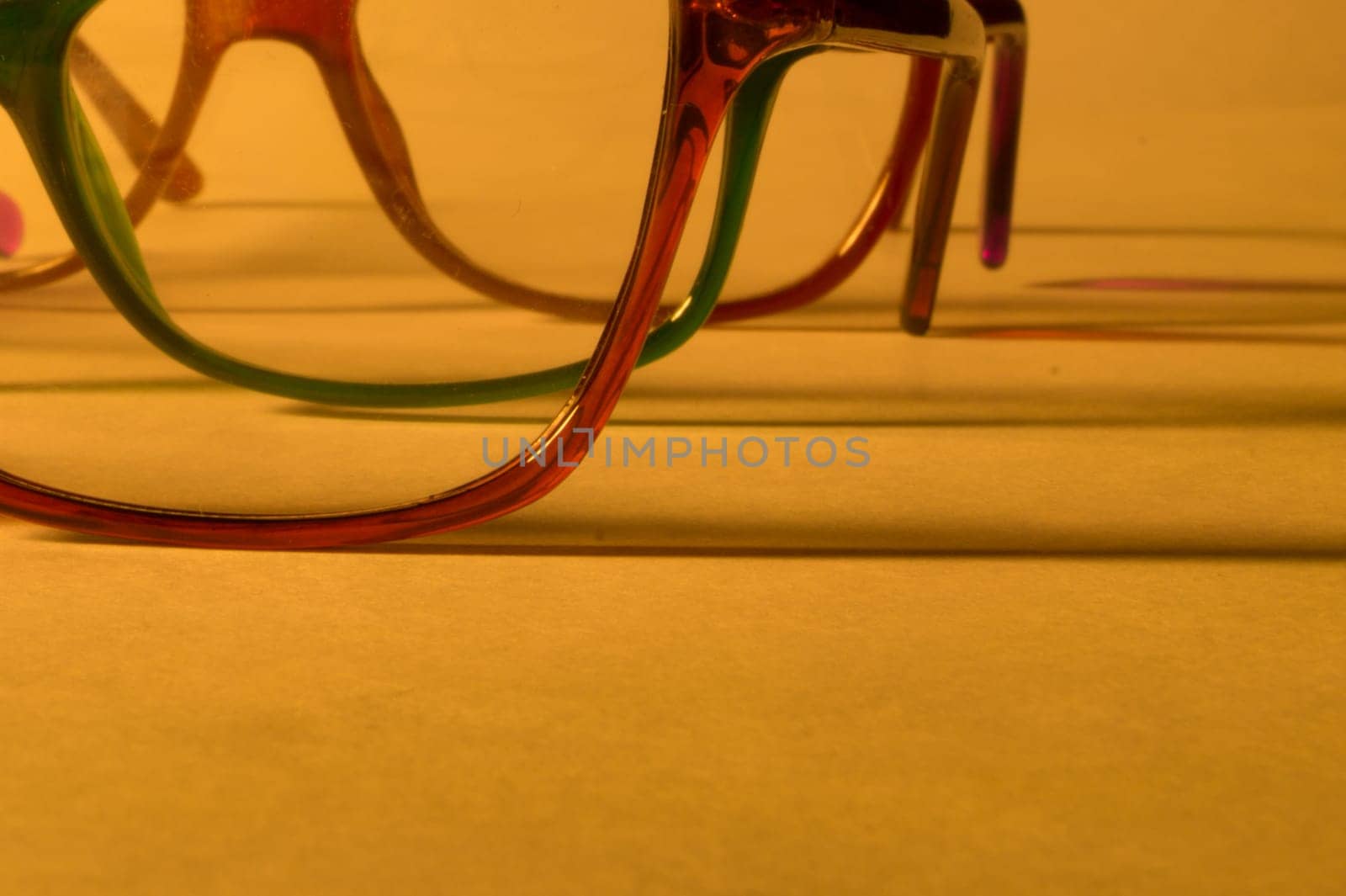 Rimmed eyeglasses closeup on a white background abstract view