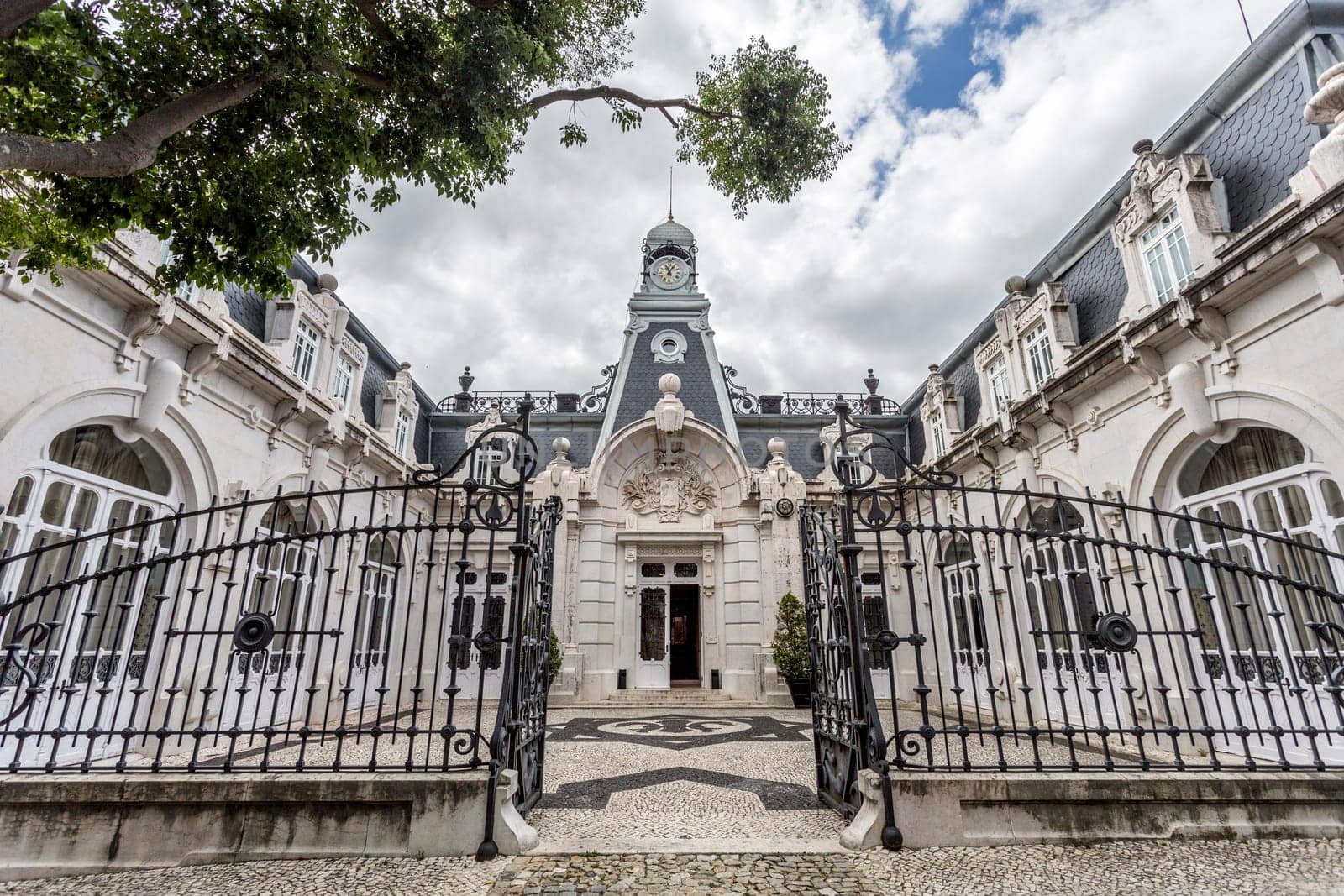 Facade of the horse stables in the same romantic style as the main Vale Flor Palace across the road, in Alcantara, Lisbon, Portugal