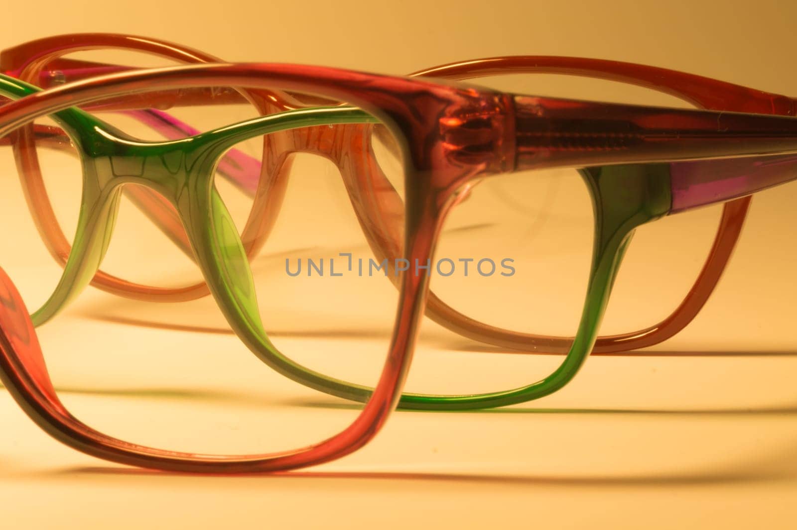 Rimmed eyeglasses closeup on a white background abstract view