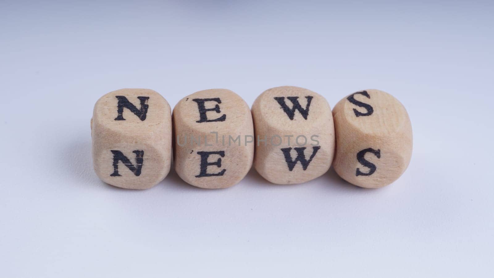 GST inscription on wooden alphabet over white background with selective focus