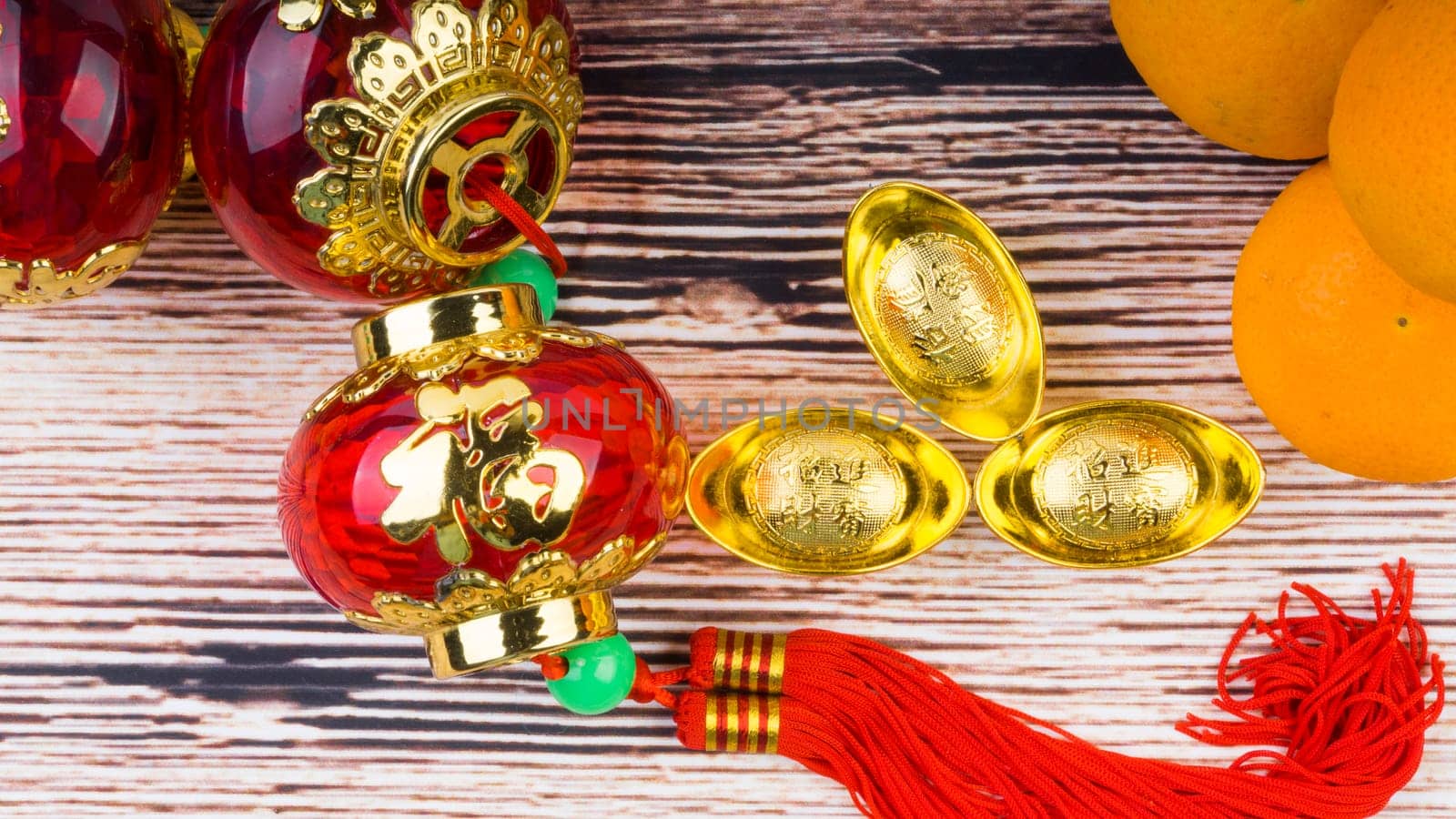 Kuala Lumpur, Malaysia- September 12, 2017:  Mandarin Orange, Red Envelopes, lantern land Gold Ingots. New Year background concept