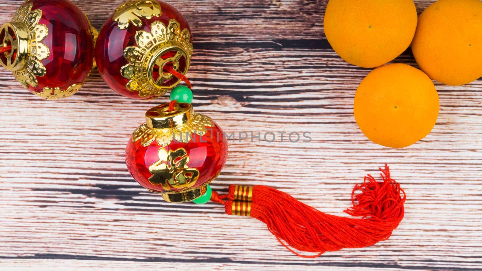 Kuala Lumpur, Malaysia- September 12, 2017:  Mandarin Orange, Red Envelopes, lantern land Gold Ingots. New Year background concept