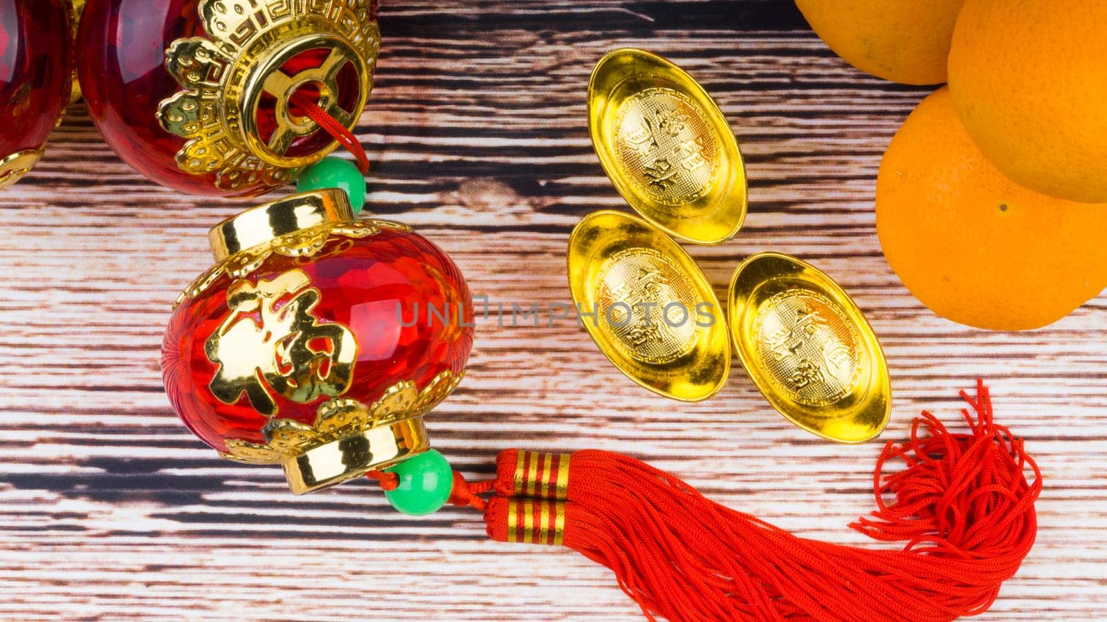 Kuala Lumpur, Malaysia- September 12, 2017:  Mandarin Orange, Red Envelopes, lantern land Gold Ingots. New Year background concept