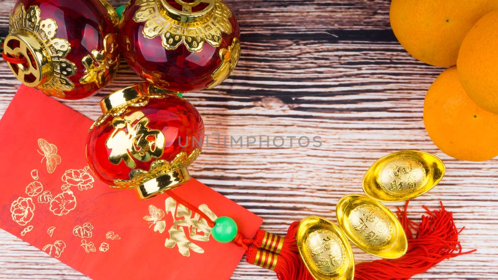 Kuala Lumpur, Malaysia- September 12, 2017:  Mandarin Orange, Red Envelopes, lantern land Gold Ingots. New Year background concept