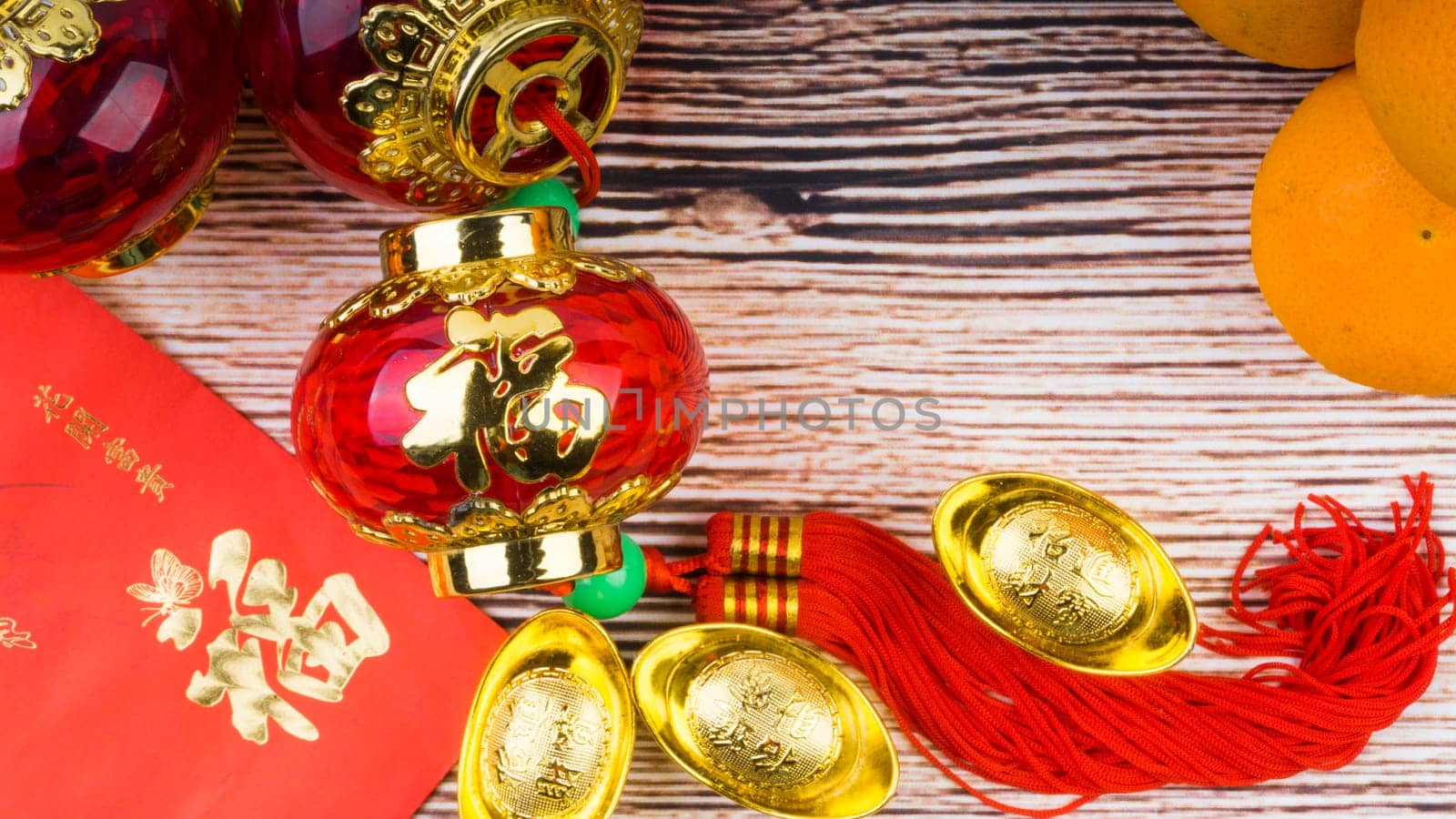 Kuala Lumpur, Malaysia- September 12, 2017:  Mandarin Orange, Red Envelopes, lantern land Gold Ingots. New Year background concept