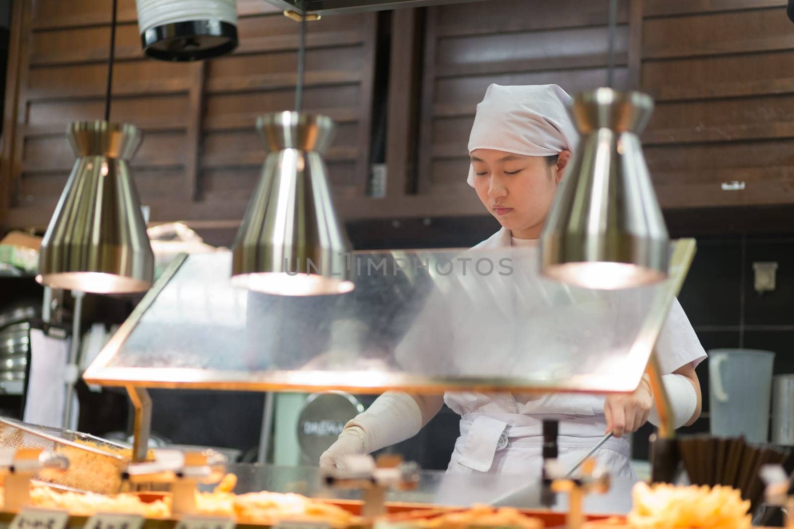 KYOTO, JAPAN - NOVEMBER 11: Ramen restaurant in Kyoto, Japan on November 11, 2016. Unidentified Japanese Ramen chefs prepare a bowl of traditional home made ramen noodle for customers.