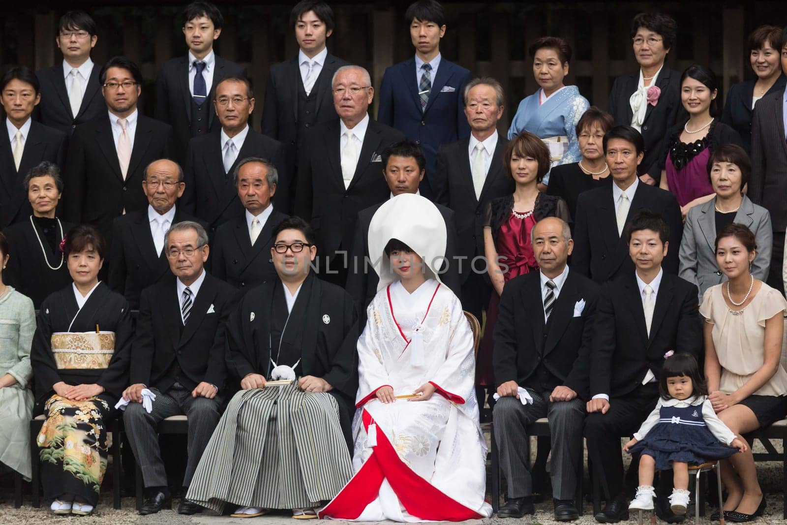 TOKYO, JAPAN - NOVEMBER 11: Official group photography ceremony of groom and bride,family and guests attending traditional japanese wedding at Meiji-jingu shrine inTokyo, Japan on November 11, 2016.