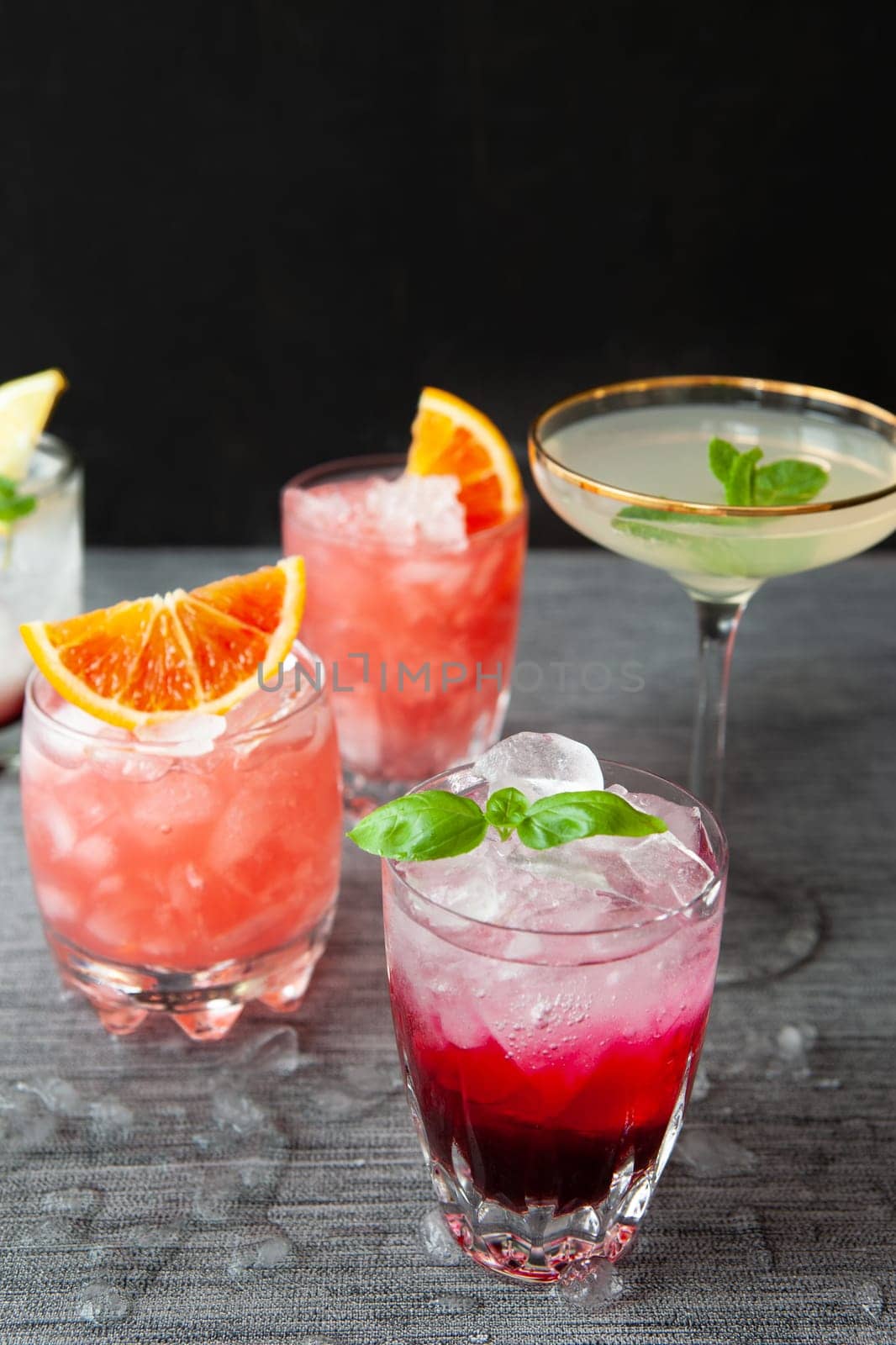 Variety of colorful cocktails and longdrinks on ice
