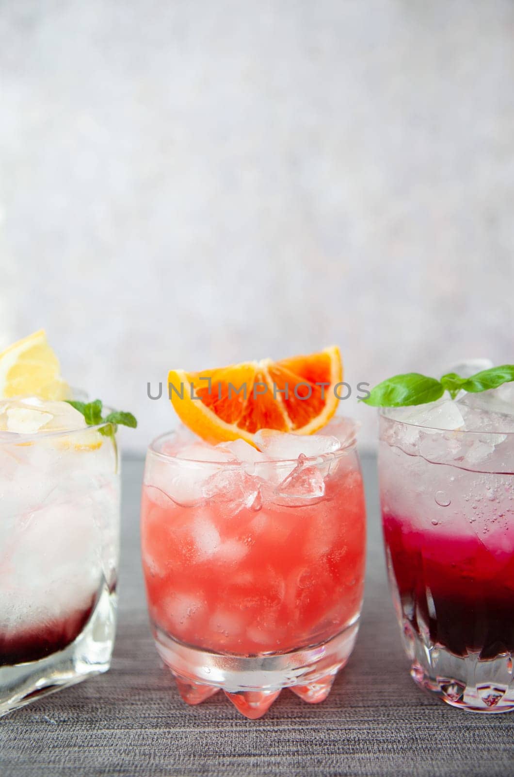 Variety of colorful cocktails and longdrinks on ice