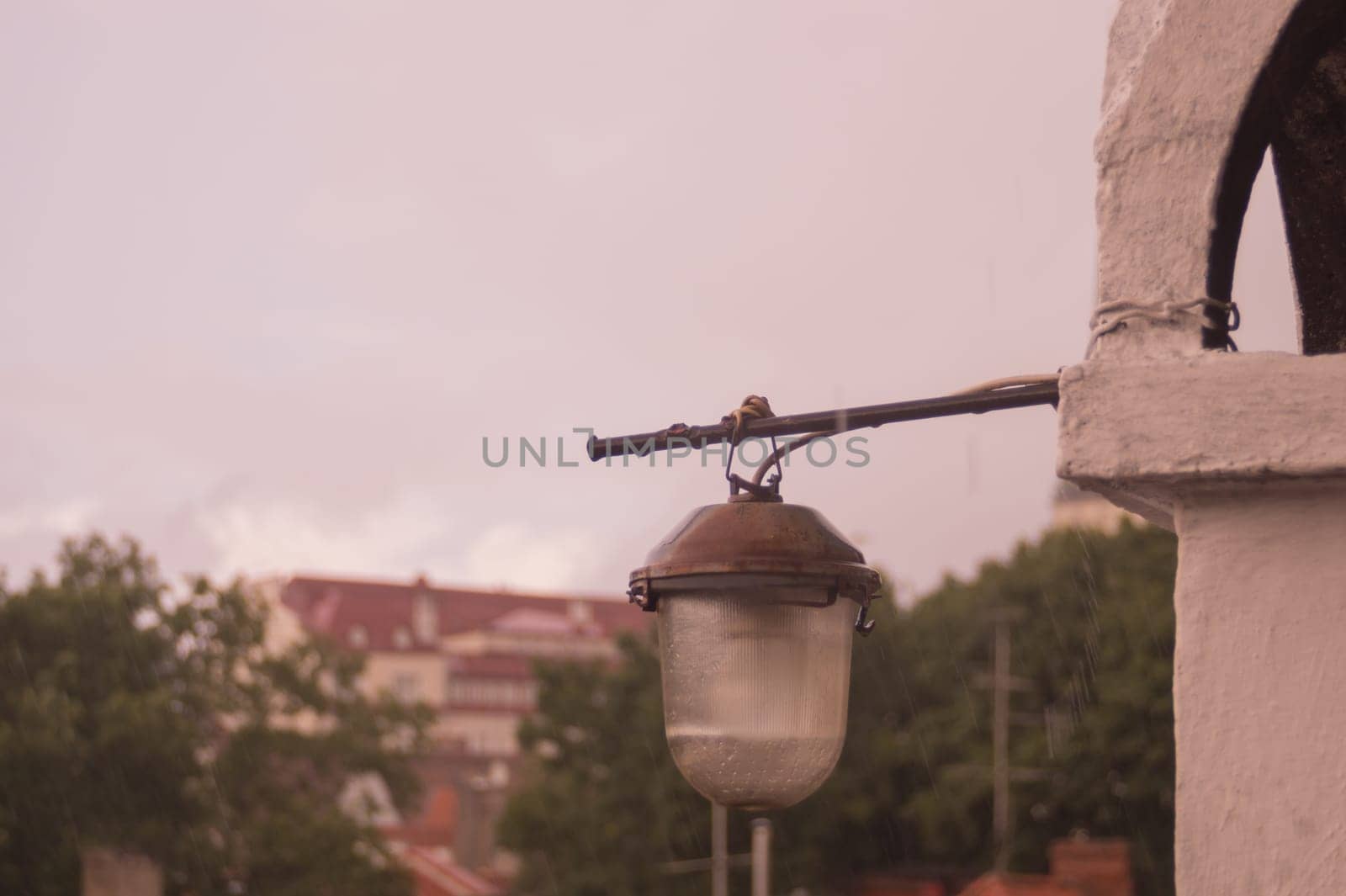 The old lantern hanging on the wall of the house background