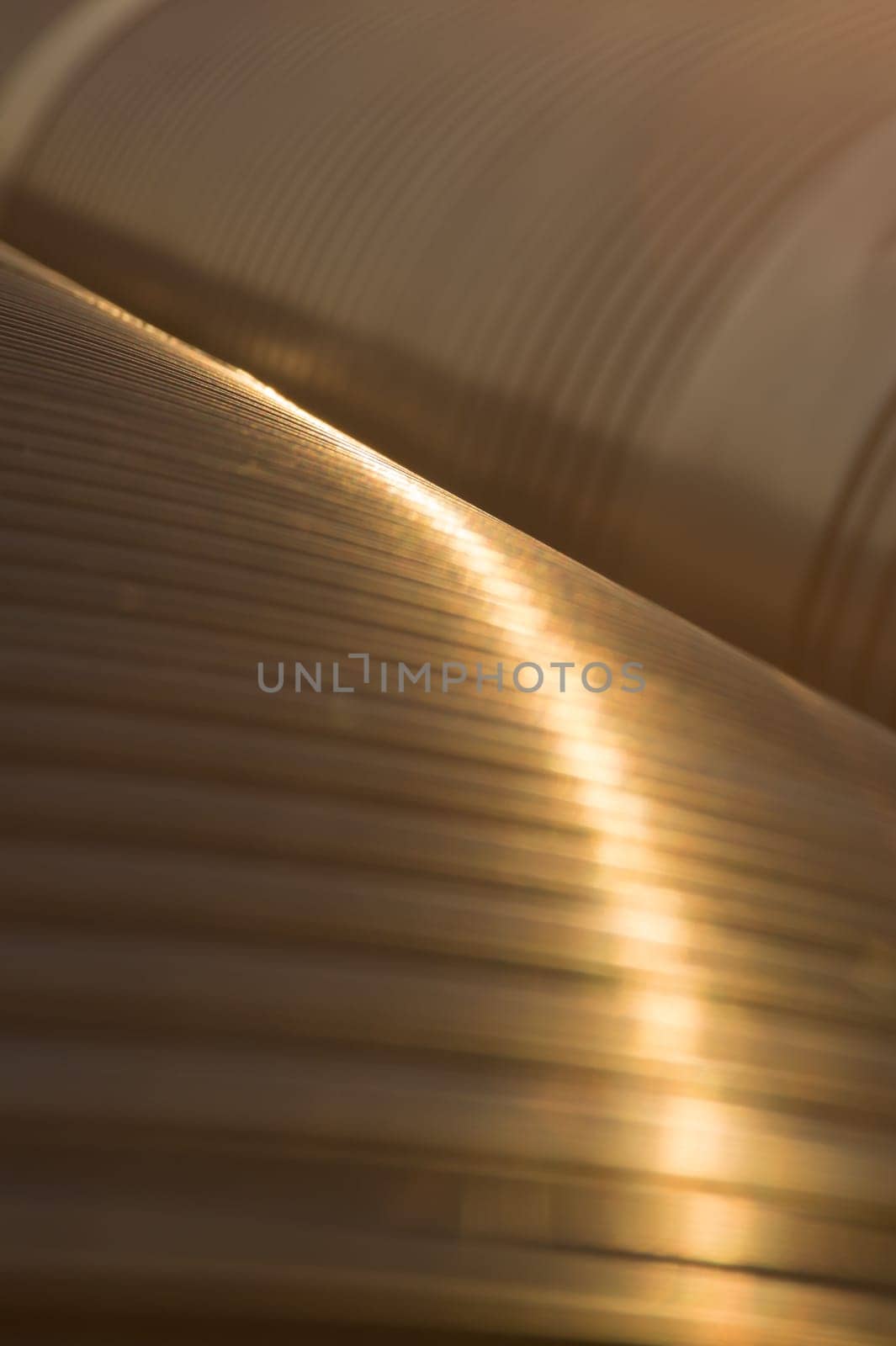 Golden metal pipes closeup background