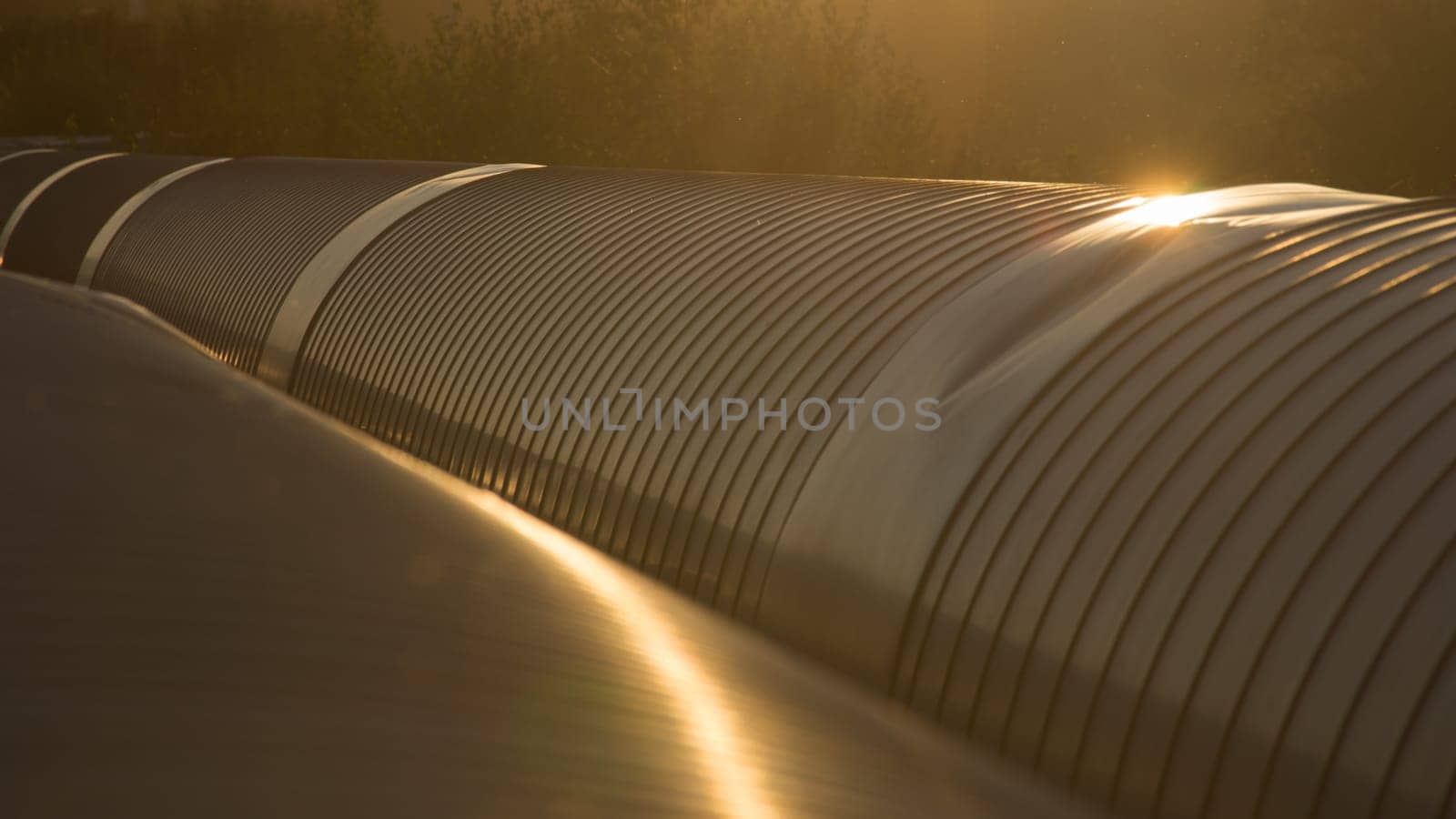 Golden metal pipes closeup background