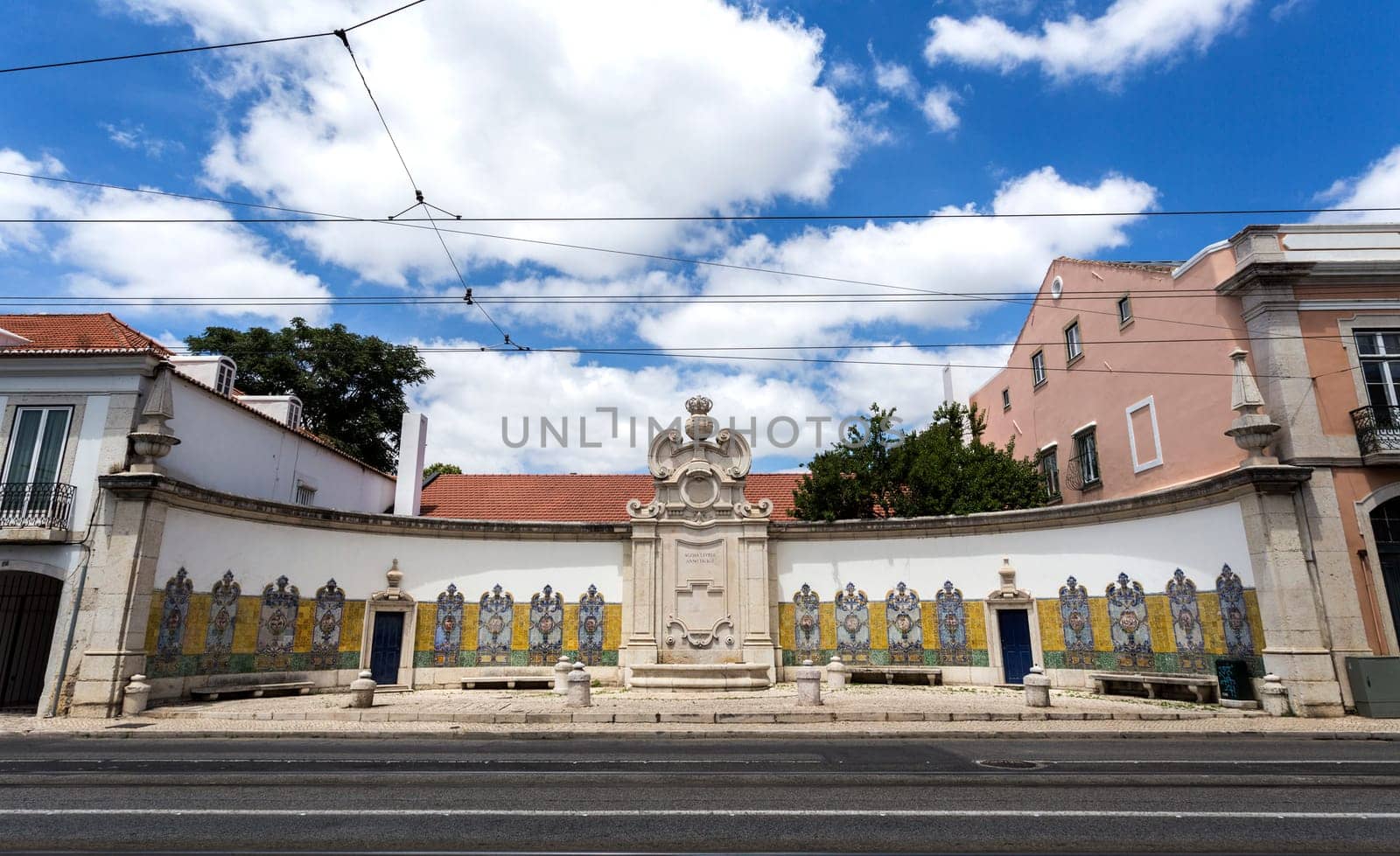 Portuguese architecture showing the Chafariz da Cordoaria, also know as Chafariz da Junqueira, built in early 19th century with lioz stone and traditional decorative tile panels, in Lisbon, Portugal.Transl: Free Water  Year 1821.