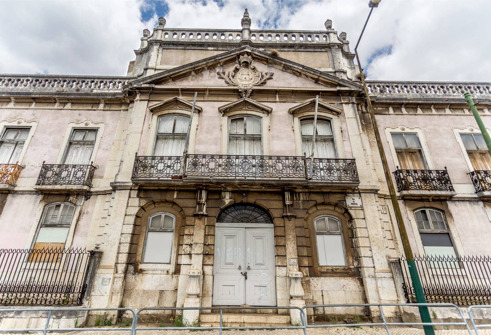 Monumental facade of the derelict Palace of Condes da Ribeira Grande, built in the early years of the 18th century in Alcantara, Lisbon, Portugal