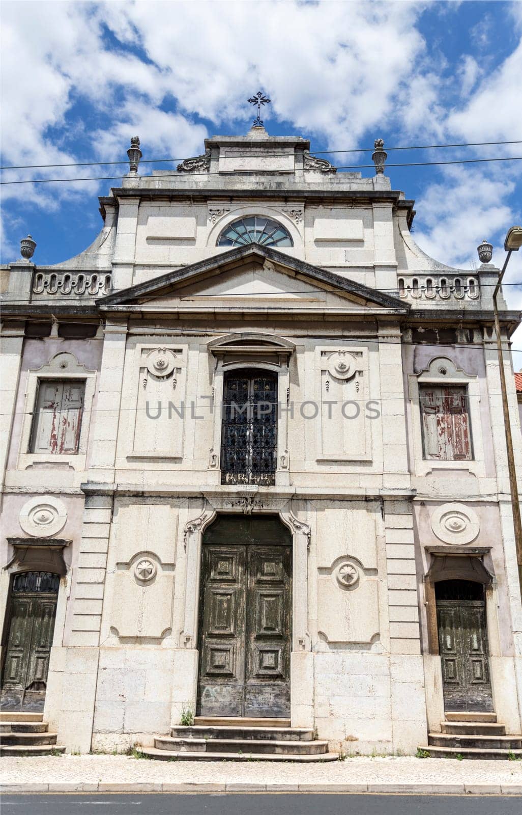View of the tripartite facade of the Chapel of Our Lady of Carmo derelict Palace of Condes da Ribeira Grande, built in the early years of the 18th century in Alcantara, Lisbon, Portugal