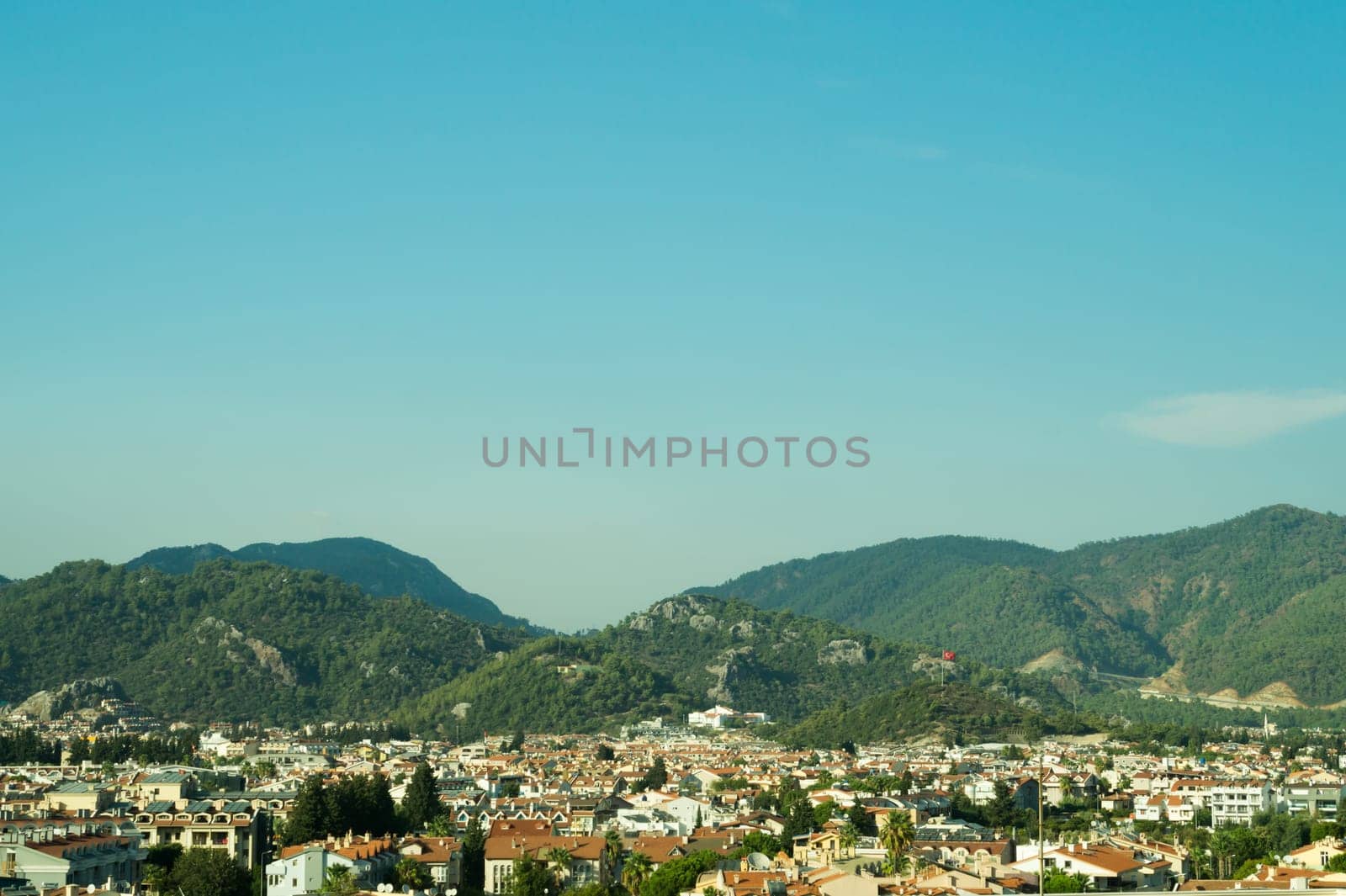 Mountain town panoramic view. landscape with a city between the hills