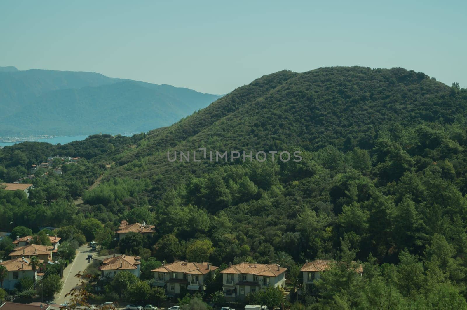 Mountain town panoramic view. landscape with a city between the hills