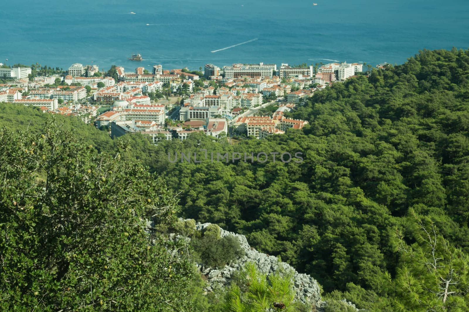 Nature landscape with a city by the shore of the sea between the hills. mountain town panoramic view