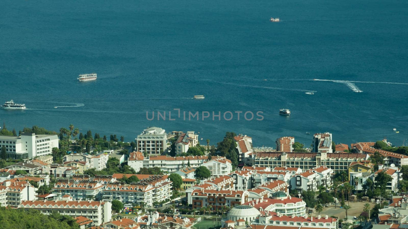 Nature landscape with a city by the shore of the sea between the hills. mountain town panoramic view