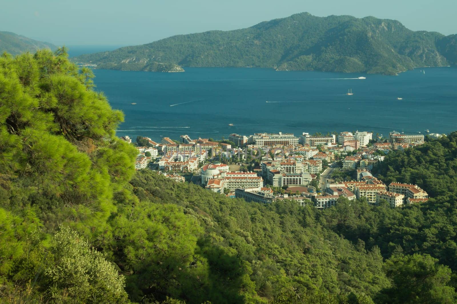 Nature landscape with a city by the shore of the sea between the hills. mountain town panoramic view