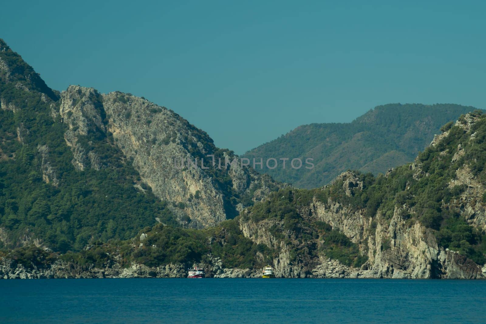 Recreation on the boat near the shore of a mountain