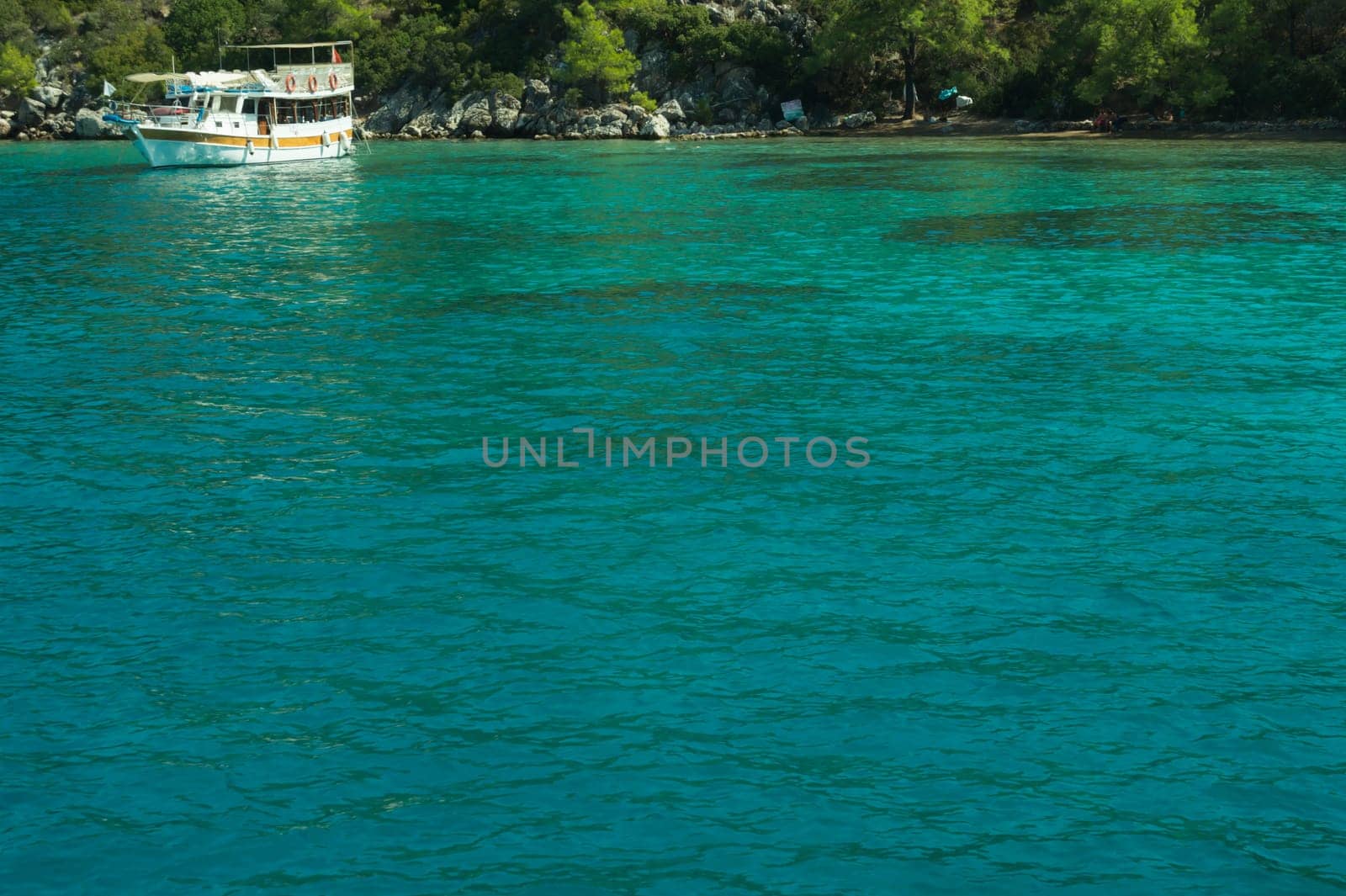 Recreation on the boat near the shore of a mountain