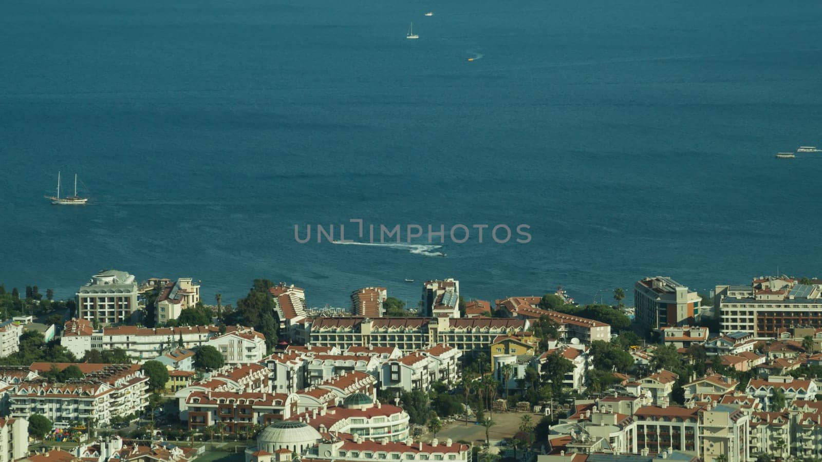 Nature landscape with a city by the shore of the sea between the hills. mountain town panoramic view