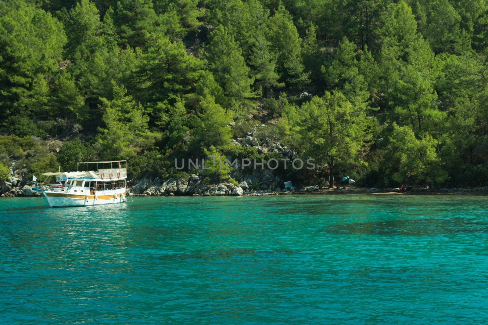 Recreation on the boat near the shore of a mountain