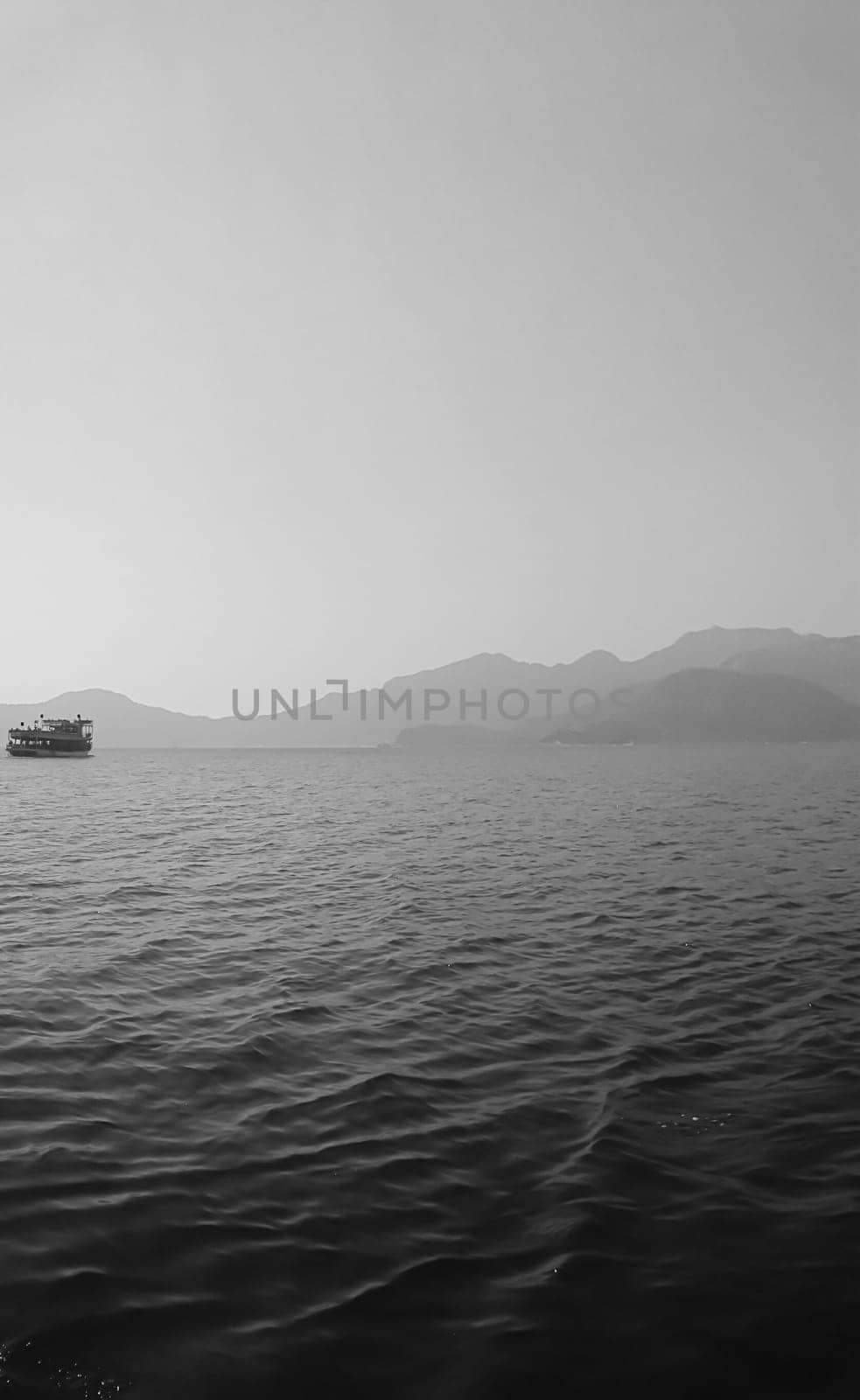Recreation on the boat near the shore of a mountain